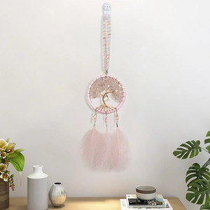 Pink dream catcher wall hanging featuring a wire life tree and elegant feathers