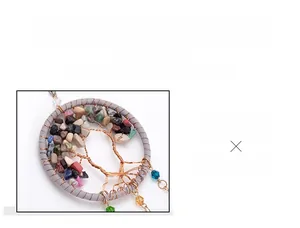 Detail of handmade Tree of Life car pendant with colorful natural stones and dreamcatcher style
