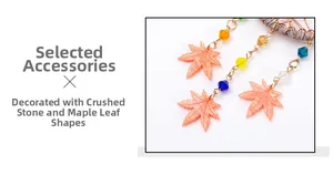Detail of dream catcher car pendant with orange resin maple leaf and colorful beads
