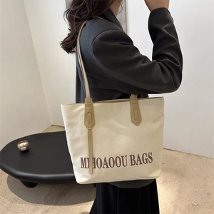Stylish large capacity cream canvas tote bag with brown leather handles for women
