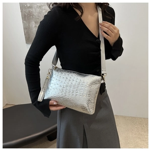 Silver crocodile pattern envelope bag with adjustable shoulder strap and wristlet detail