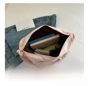 Detailed interior view of a large pink nylon tote bag showing its spacious capacity