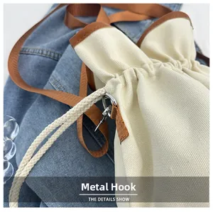 Close-up of durable canvas bucket bag with premium metal hardware hook and strap