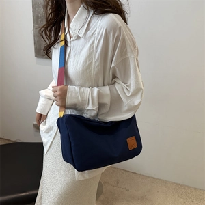 Large navy blue canvas tote bag with a vintage colorful striped wide shoulder strap