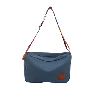 Retro high-capacity canvas tote bag in navy blue with a striped crossbody shoulder strap