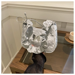 Silver-grey pleated handbag with metallic butterfly clasp and ruffled edge detail