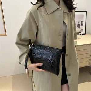 Chic black crocodile embossed clutch bag with top zipper and wristlet strap for women