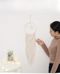 Detailed handmade macrame moon dreamcatcher with star weaving and long cotton tassels