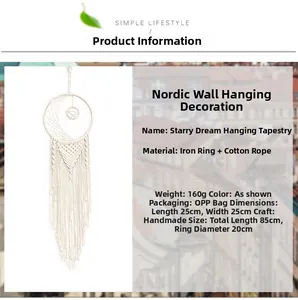 Macro detail of large moon and star dreamcatcher showing handmade woven cotton fringe texture