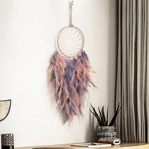 Handmade dreamcatcher with pink feathers and pearls for bohemian wall decor