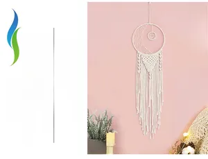 Close-up of cream white bohemian woven moon dreamcatcher with detailed tassels
