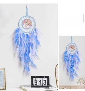 Detail of life tree dreamcatcher with pink stones and sky blue gradient feathers