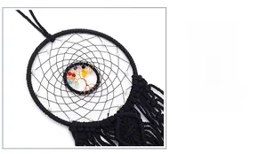 Detail of handmade black woven dream catcher with colorful Tree of Life crystal stones