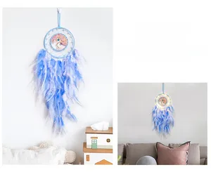 Detail of life tree dream catcher with blue feathers and built-in LED lighting