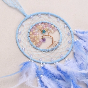 Blue Tree of Life dream catcher hanging with feathers and beaded bohemian wall decor