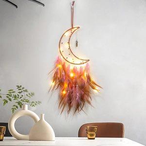Handmade moon dream catcher with warm LED lights and gradient pink feathers for wall decor