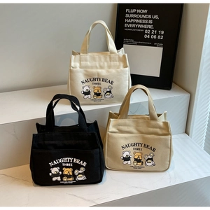 Three-piece cartoon canvas tote bag set in black, cream and khaki with naughty bear print