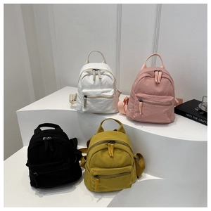 Minimalist canvas backpacks for women in white, pink, black and yellow colors
