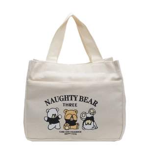 Off-white canvas tote bag featuring cute cartoon bears and Naughty Bear slogan print