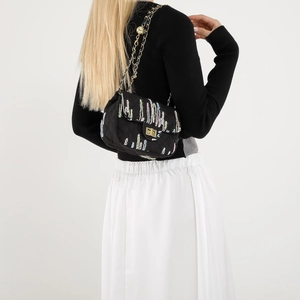 Fashionable black quilted crossbody bag with colorful embroidery and golden chain strap