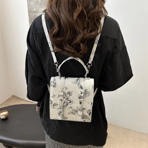 White mini backpack with vintage black butterfly print and silver metal buckles