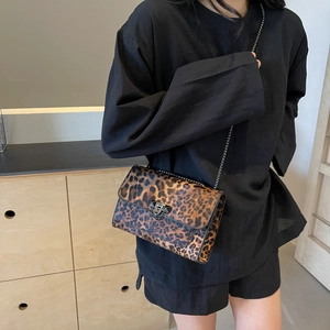 Vintage leopard print shoulder bag with metal chain strap and V-shaped rivet detail