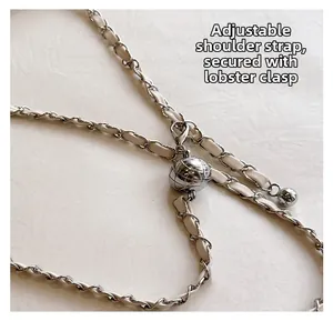 Close-up of adjustable woven leather and silver metal chain strap with sphere slider