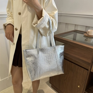 Silver crocodile embossed large tote bag for women showing a stylish commute look