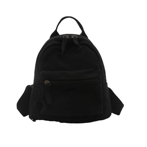 Minimalist black canvas mini backpack featuring double zip compartments and top handle