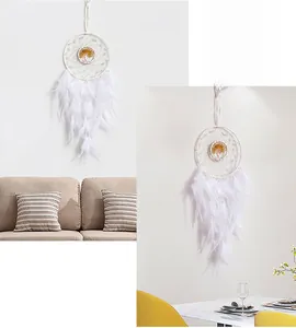 Detailed white dreamcatcher with tree of life emblem and soft feathers for wall decor