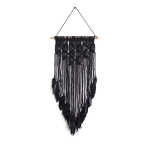 Handmade black dream catcher wall hanging with feathers and wooden beads on white backdrop