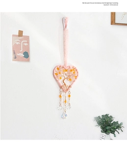 Detailed view of handmade heart tree of life hanging decor with pink rose quartz stones