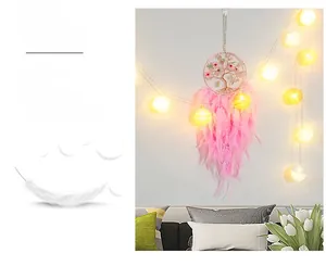 Pink dream catcher with cherry blossom tree design, feathers and warm LED light