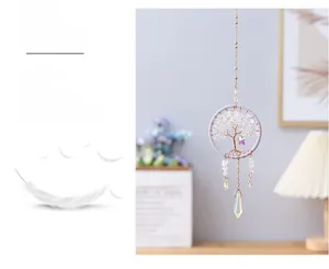 Detailed view of handmade Tree of Life dreamcatcher with purple thread and crystal stones