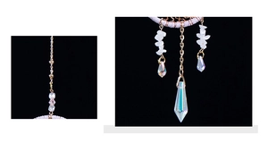 Detail of crystal suncatcher with moon metal chain and iridescent glass prisms