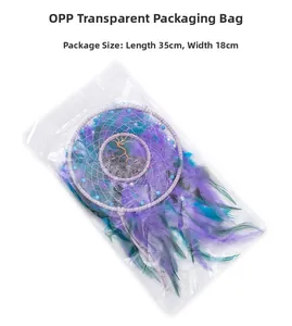 Detail of tree of life dreamcatcher with purple feathers and 35x18cm packaging size