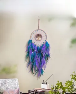 Detailed dreamcatcher with purple feathers and a wire-wrapped tree of life design