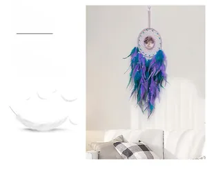 Detail of tree of life dreamcatcher with purple feathers and turquoise beads wall decor