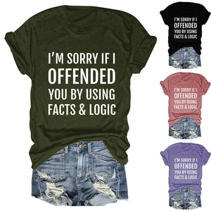 Detail of crew neck T-shirts with slogan print in green, black, burgundy and purple colors