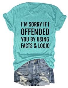 Detail of teal short sleeve T-shirt with funny facts and logic slogan and denim shorts