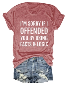 Detail of brick red slogan T-shirt paired with distressed denim shorts for casual style