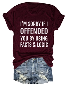Detail of burgundy crew neck t-shirt with slogan paired with distressed denim shorts