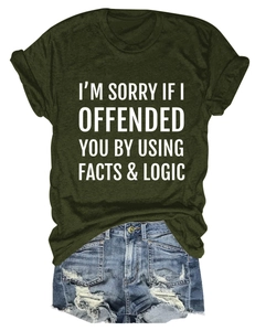 Flat lay of olive green slogan t-shirt paired with distressed light blue denim shorts