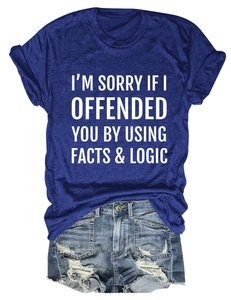 Detail of navy blue slogan t-shirt paired with distressed high-waisted denim shorts