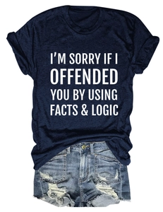 Flat lay of navy cotton T-shirt with slogan and distressed light blue denim shorts