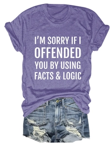 Flat lay of purple cotton T-shirt with white slogan paired with distressed denim shorts