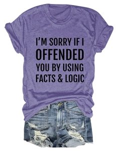 Close-up of funny slogan on purple short sleeve t-shirt with denim shorts combo