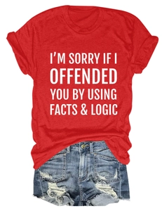 Detailed flat lay of red cotton T-shirt with white slogan and distressed denim shorts