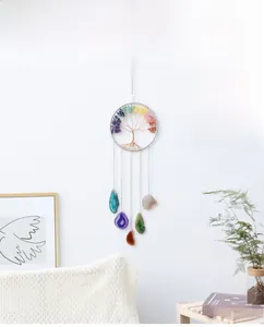 Detail of tree of life wall hanging with colorful crystal stones and agate slices