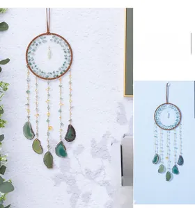 Detail of dream catcher with agate slices and colorful beads for home wall decoration